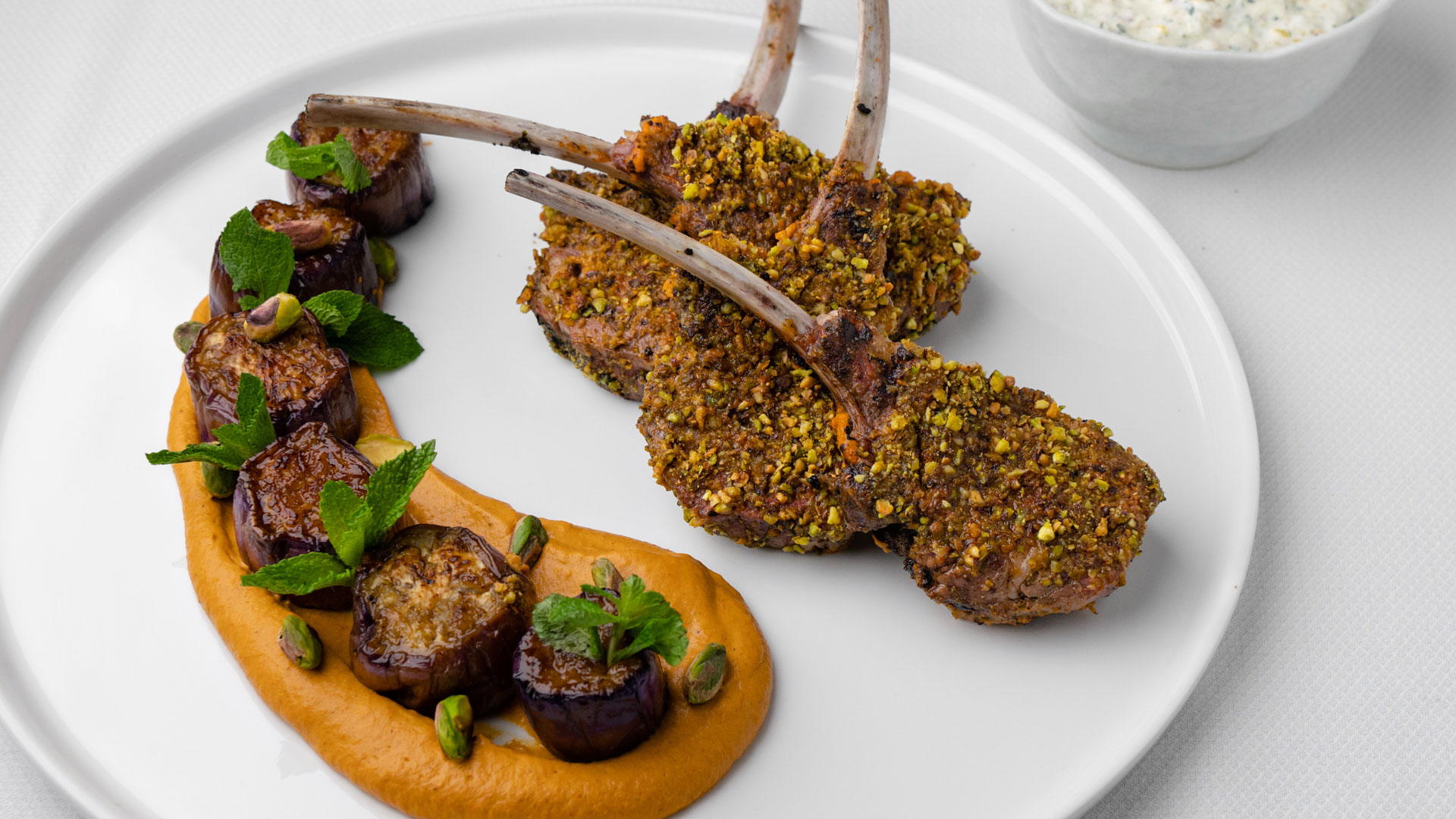 Harissa Spiced Lamb with Glazed Eggplant and Pistachio Raita